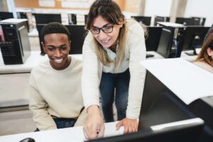 Teacher working with student